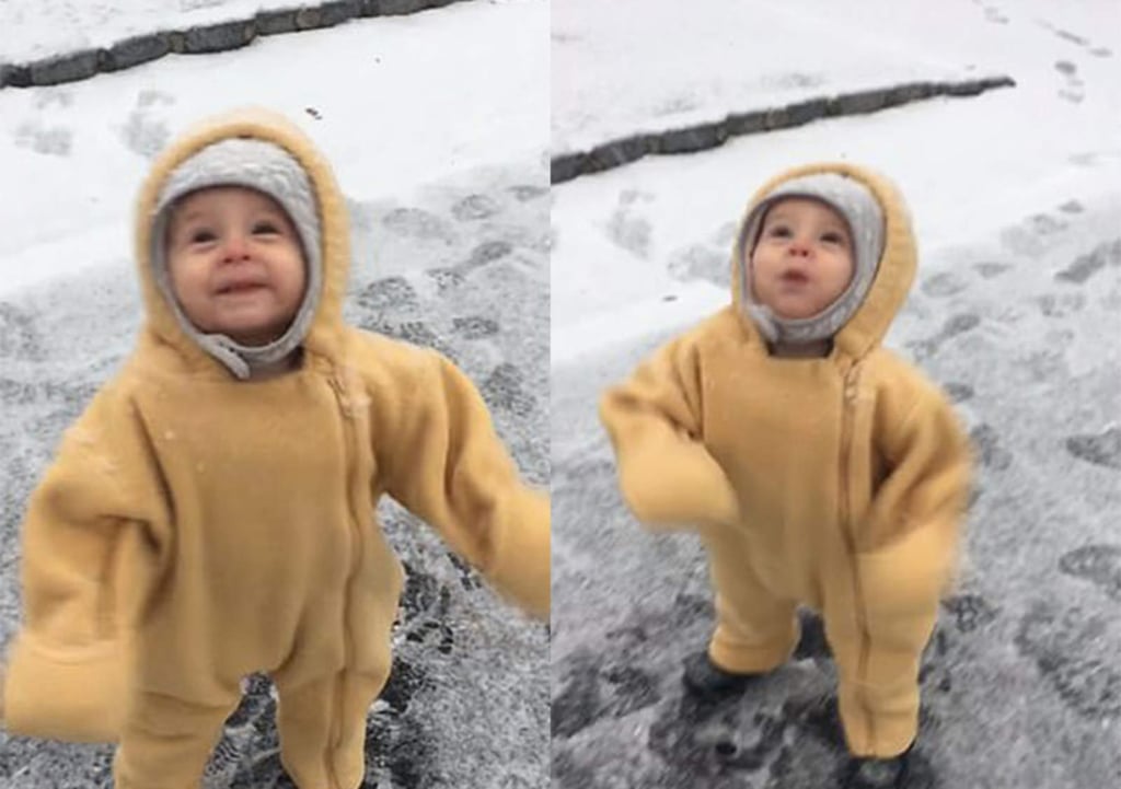 Adorable bebé disfruta la nieve por primera vez