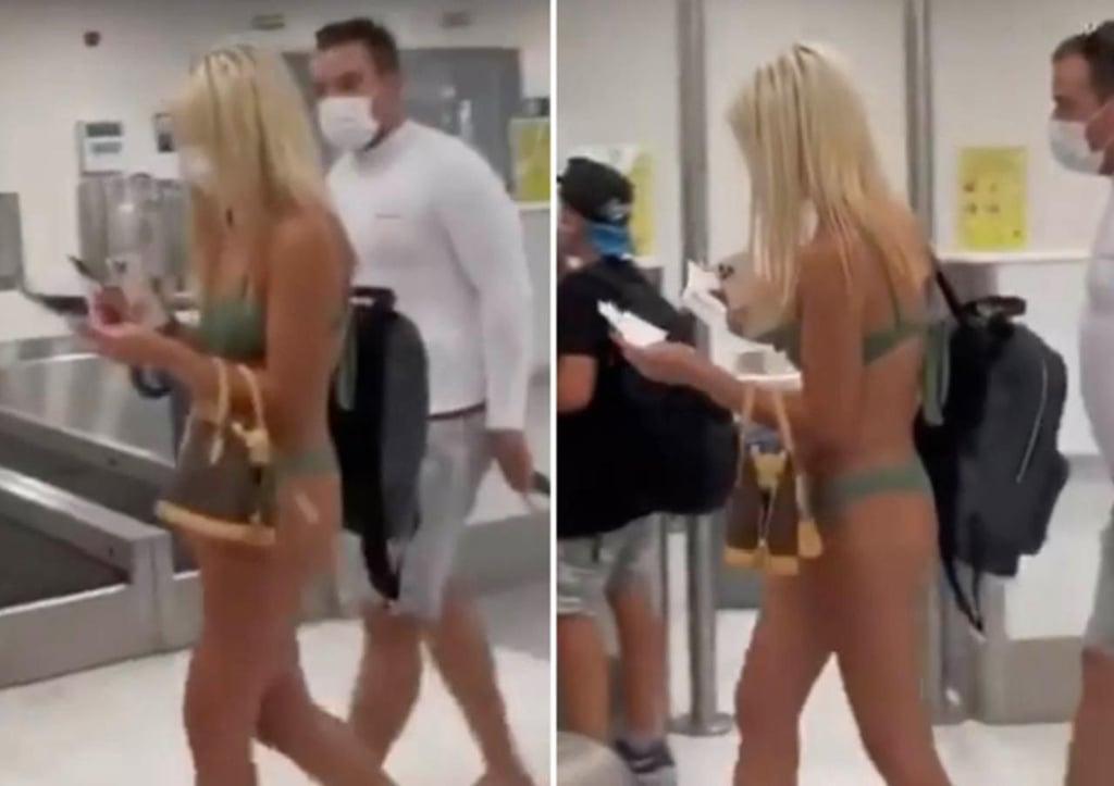 Mujer es vista en un aeropuerto de EU en bikini y con cubrebocas