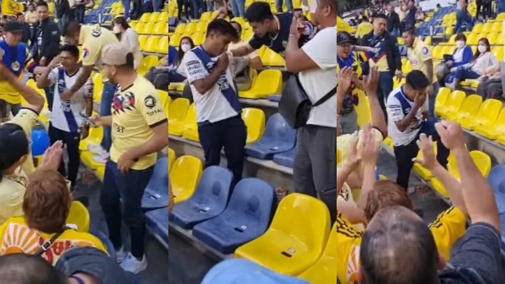 Americanistas consuelan al aficionado del Puebla que lloraba en el Estadio Azteca