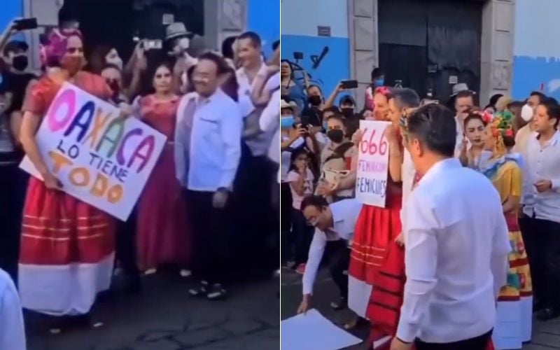 Con cartel de ‘666 feminicidios’, mujer protesta frente al gobernador de Oaxaca durante Guelaguetza