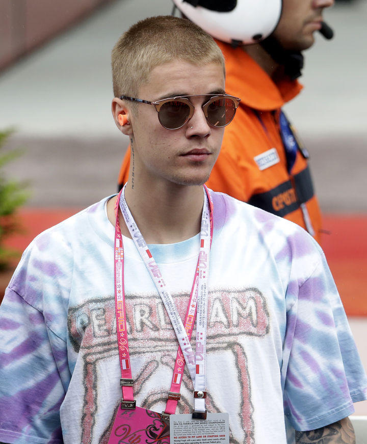 Justin Bieber waits in pit lane following the Monaco Formula One Grand Prix at the Monaco racetrack in Monaco, Sunday, May 29, 2016. (AP Photo/Petr David Josek)