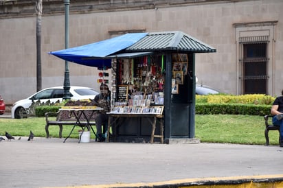 Religión. El puesto se vuelve un punto de encuentro para quienes buscan protección o hacer una promesa.